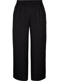 Loose trousers with elasticated waistband and pockets