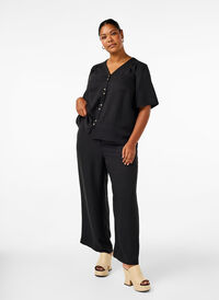 Loose trousers with elasticated waistband and pockets, Black, Model